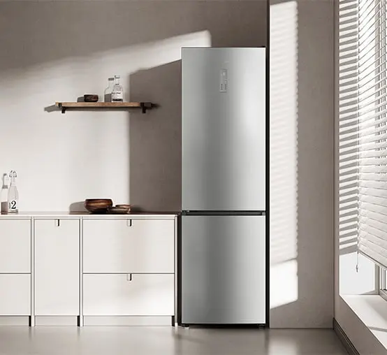 Dreame refrigerator in a minimalist kitchen illuminated by light coming through blinds