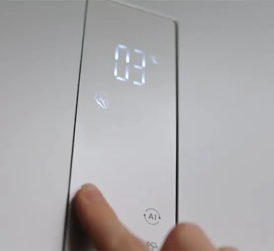 Close-up of the refrigerator touch panel displaying a temperature of 3°C and a leaf icon