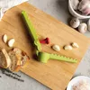 Пресс для чеснока с ручкой Ototo Design Garligator Photo 2