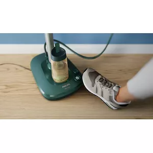 The base has foot buttons and a detachable water tank