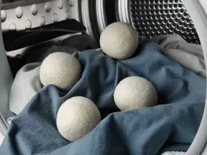 Veļas žāvētāja bumbas Electrolux M9YHODB2 4 gab. — Jaunzēlandes vilna, baltas