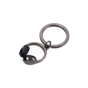 Keychain TROIKA metal headphone design KR17-07/GM, compact accessory for keys and bags