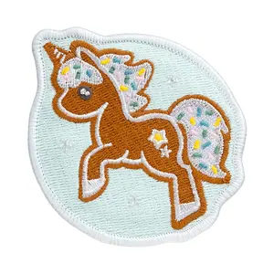 Badge LAUT MAGMOJI BADGE – Unicorn Cookie Christmas Edition, PVC & Silicone, Brown/Light Blue, 1 pc