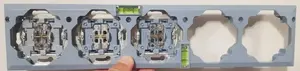 Mounting frame with spirit level Kontakt‑Simon SRM for electrical switches and sockets