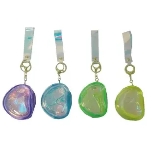 Coin pouch and keychain 2-in-1 Swede with swirling sand design — compact accessory