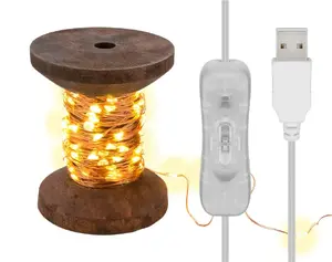 Fairy Lights GOOBAY "Yarn Bobbin" small — 100 LED warm white, USB powered, copper/plastic/wood housing