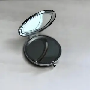 Compact round pocket cosmetic mirror Szaron - model 643275, portable hand mirror