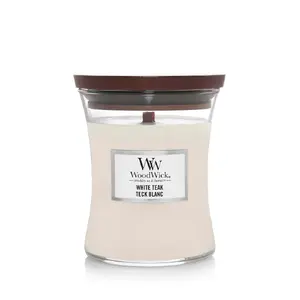 WoodWick White Teak cilindriska aromātiskā vaska svece ar ciedrkoka, ozolkoka, ozolsūnu un sandalkoka smaržas notīm